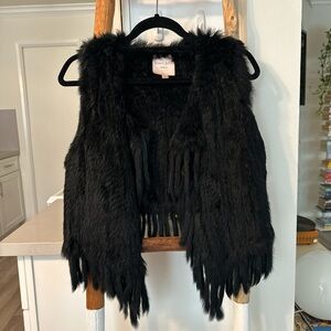 Rabbit fur fringe vest.